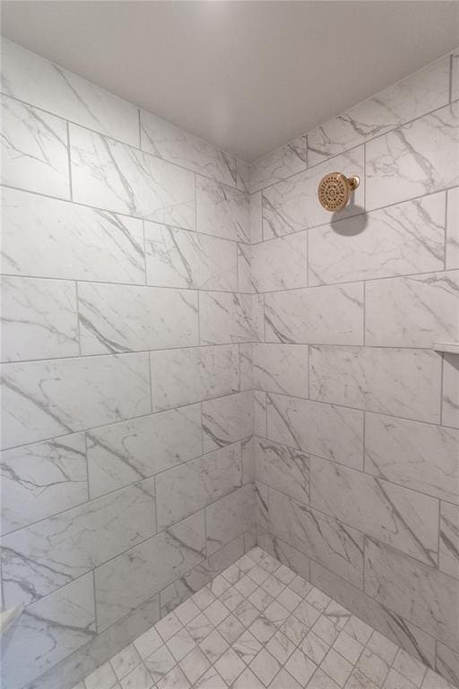 full bathroom with tiled shower