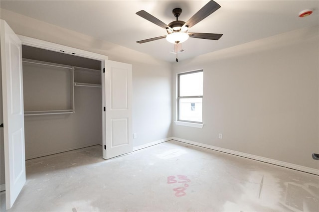 unfurnished bedroom with ceiling fan, a closet, and unfinished concrete flooring