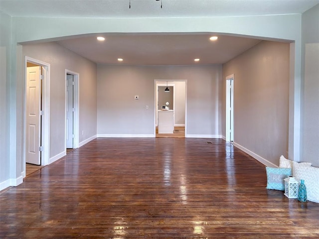 spare room with dark wood-type flooring