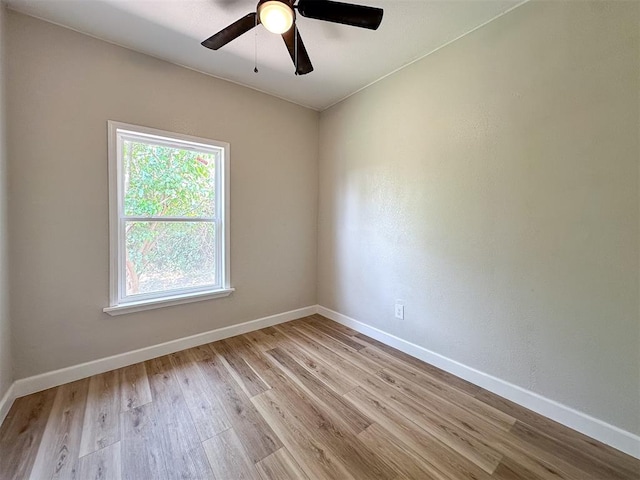 unfurnished room featuring light hardwood / wood-style floors and ceiling fan