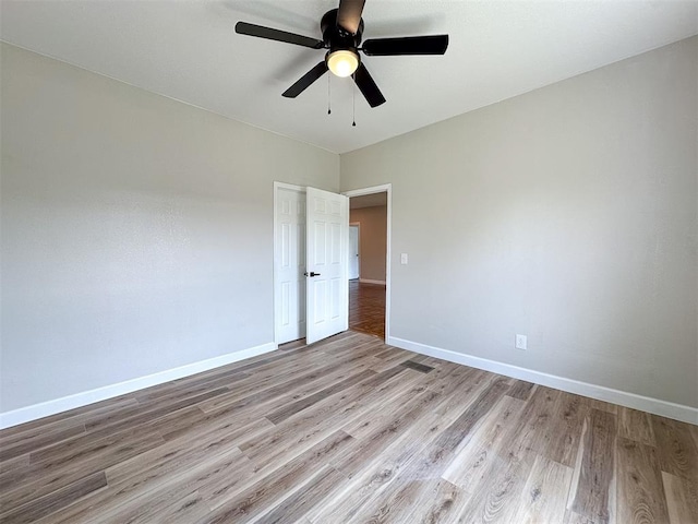 unfurnished room featuring ceiling fan and light hardwood / wood-style flooring