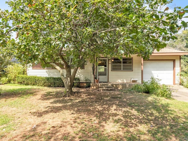 obstructed view of property featuring a garage