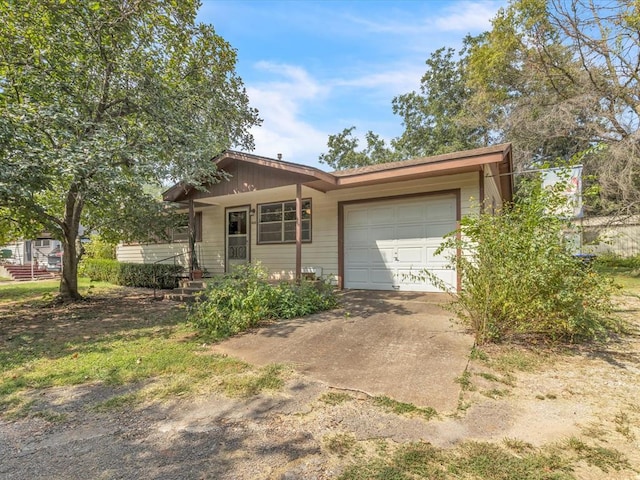 ranch-style house featuring a garage