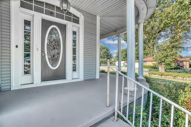 view of exterior entry with covered porch