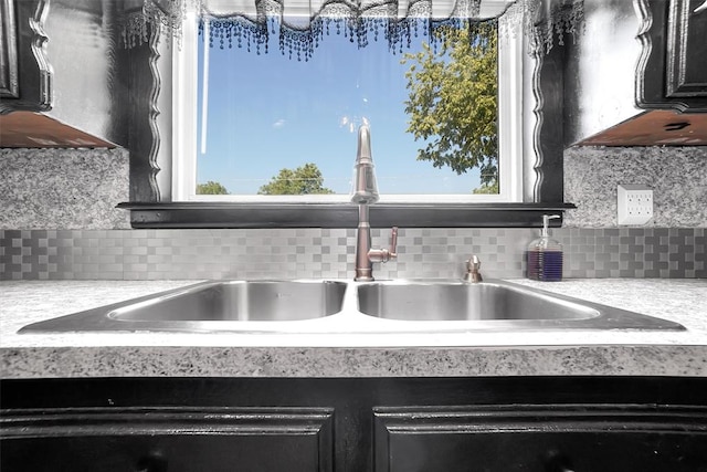 details featuring backsplash and sink