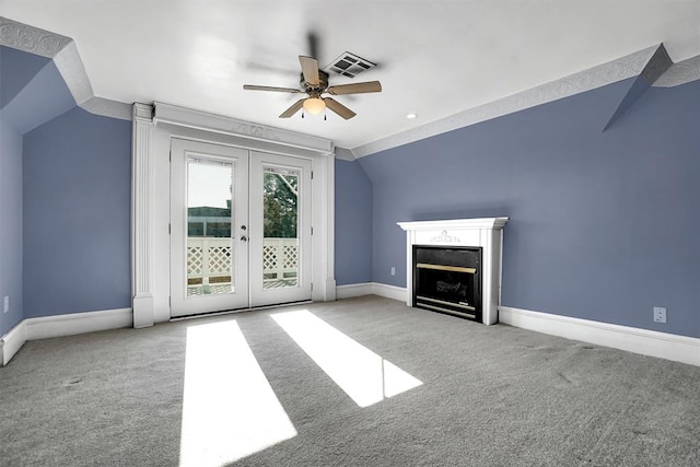 unfurnished living room with light carpet, french doors, ceiling fan, and lofted ceiling