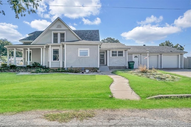 view of front of home featuring a front yard and a garage