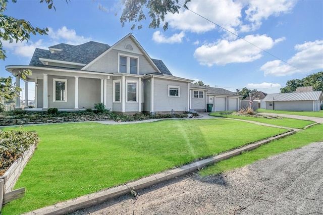 view of front of property with a garage and a front yard