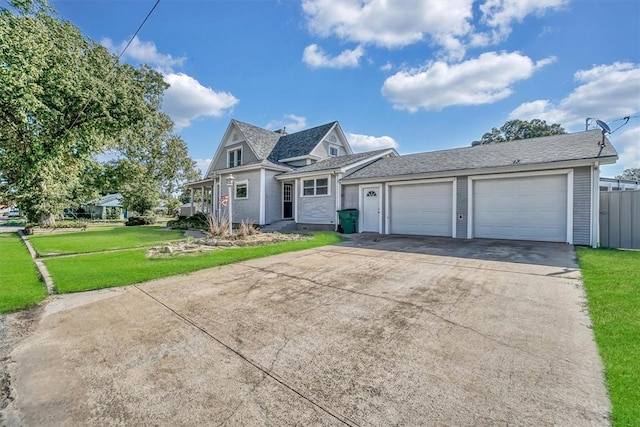 view of front facade featuring a garage and a front lawn