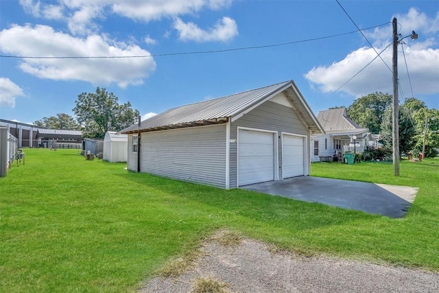 garage with a yard