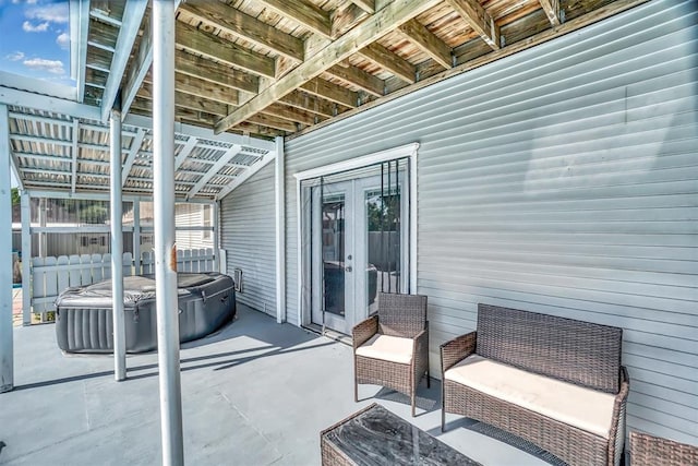 view of patio featuring french doors and a hot tub