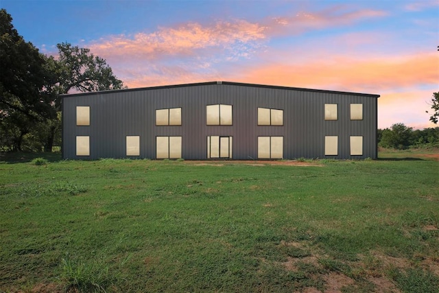 view of outdoor building at dusk