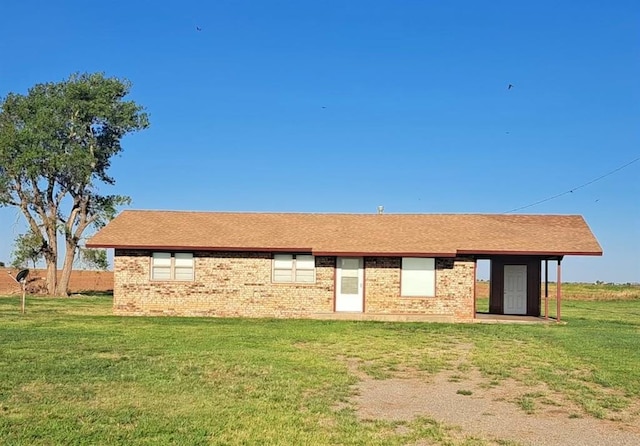 back of house with a yard