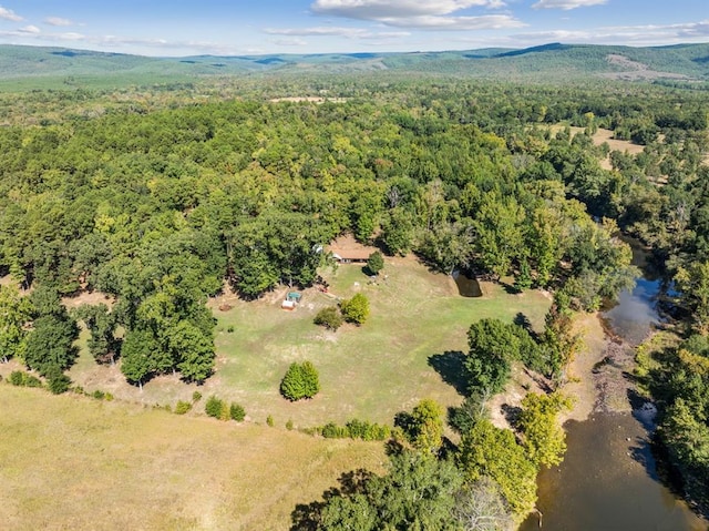 drone / aerial view featuring a water and mountain view