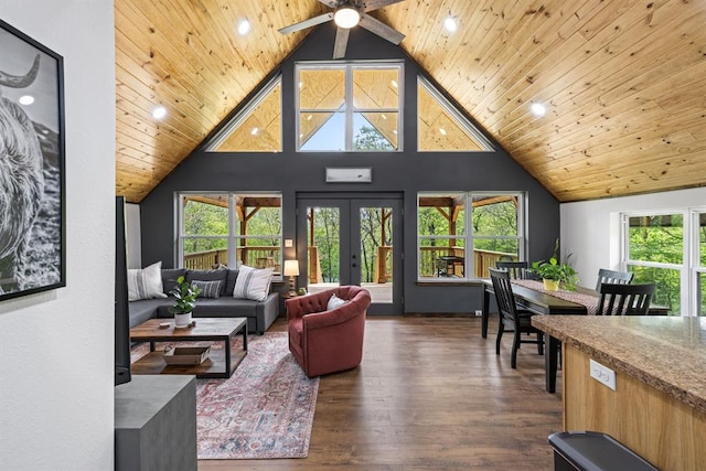 living room with a wealth of natural light, dark hardwood / wood-style flooring, high vaulted ceiling, and wooden ceiling