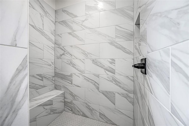 bathroom featuring tiled shower