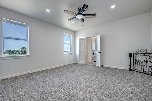 unfurnished bedroom with carpet flooring and ceiling fan