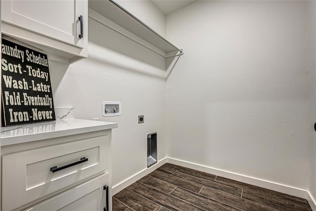 clothes washing area with electric dryer hookup, dark hardwood / wood-style floors, cabinets, and hookup for a washing machine