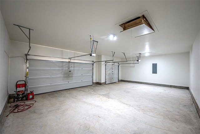 garage featuring electric panel and a garage door opener