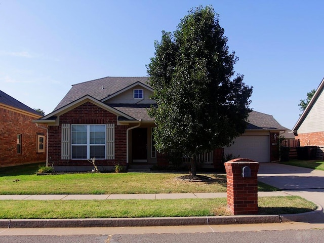 view of front of property with a garage and a front yard