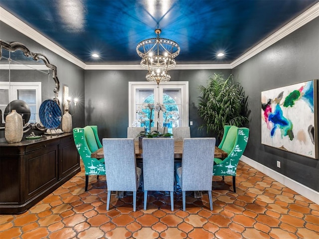 tiled dining room featuring a chandelier, crown molding, and french doors