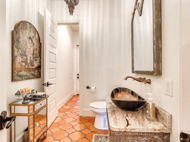 bathroom featuring toilet and sink