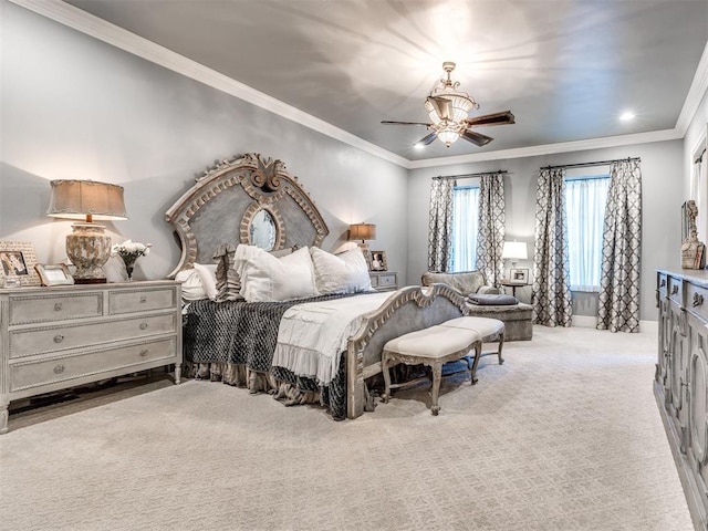 carpeted bedroom with ceiling fan and ornamental molding