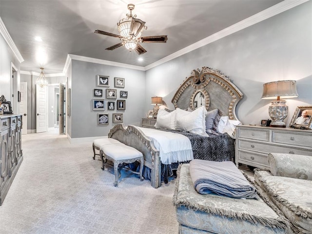 carpeted bedroom featuring ceiling fan and crown molding