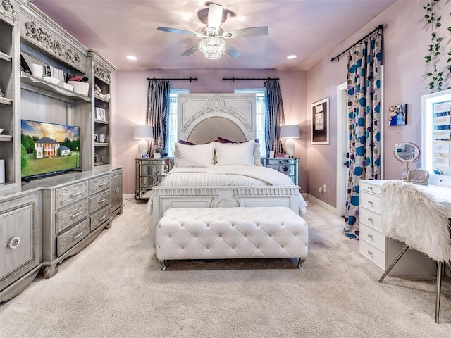 carpeted bedroom with ceiling fan