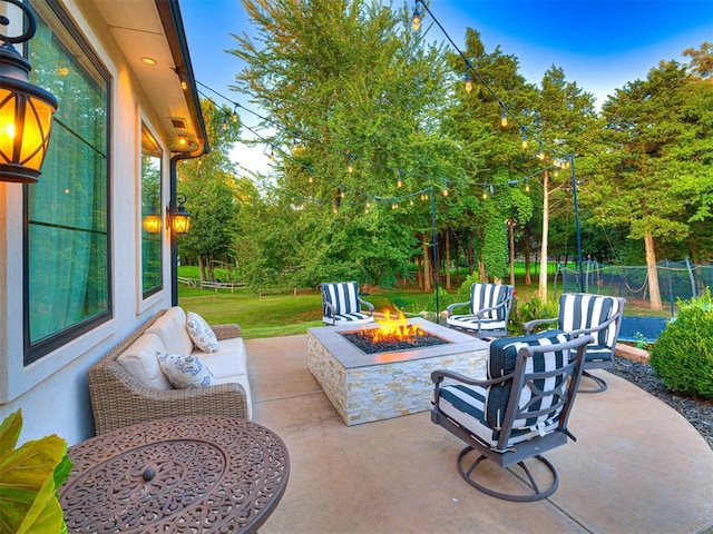 view of patio / terrace featuring a fire pit