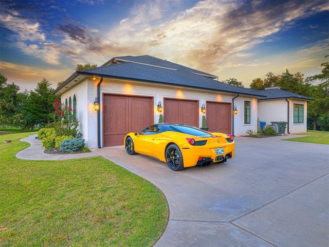 view of front of house with a lawn and a garage