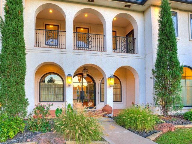 doorway to property featuring a balcony