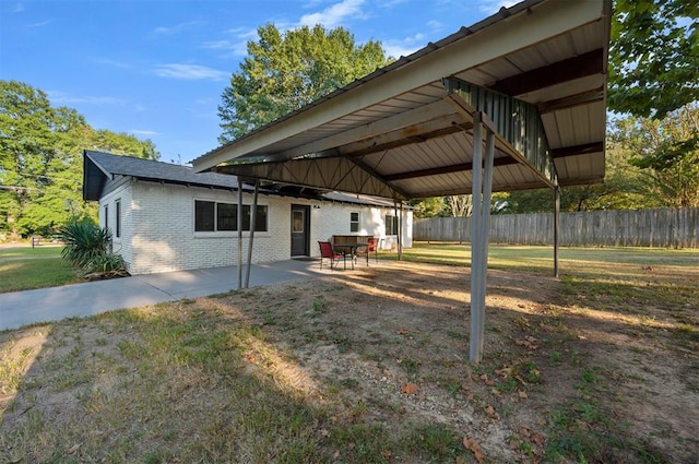 exterior space featuring a patio and a lawn