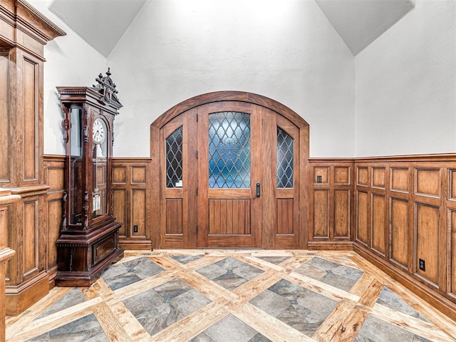 entrance foyer with vaulted ceiling