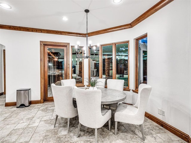 dining space featuring a chandelier and ornamental molding