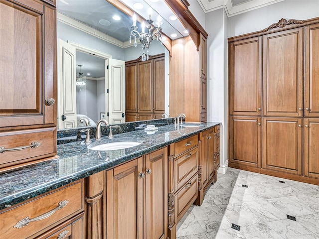 bathroom featuring crown molding and vanity