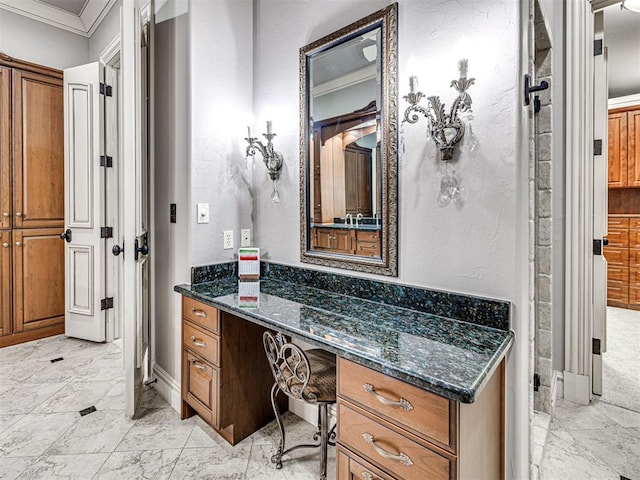 bathroom with vanity and ornamental molding