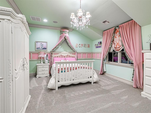 carpeted bedroom featuring crown molding, a nursery area, lofted ceiling, and a notable chandelier