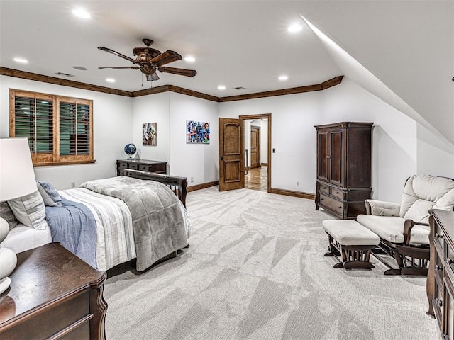 bedroom featuring ceiling fan, crown molding, and light colored carpet