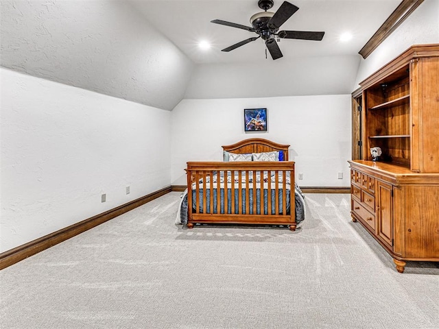 carpeted bedroom with ceiling fan and lofted ceiling