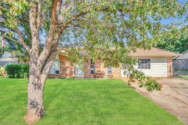 ranch-style house with a front lawn