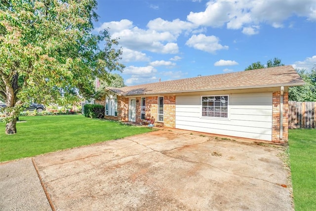 ranch-style home with a front lawn