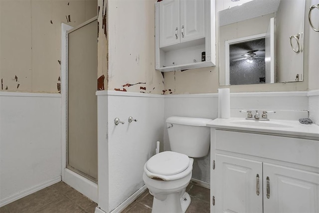 bathroom featuring tile patterned floors, toilet, an enclosed shower, and vanity