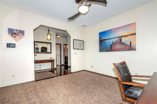 home office with ceiling fan and carpet floors