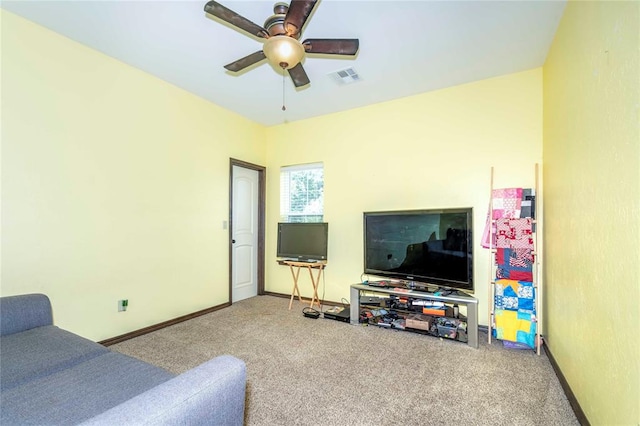 living room featuring ceiling fan and carpet floors