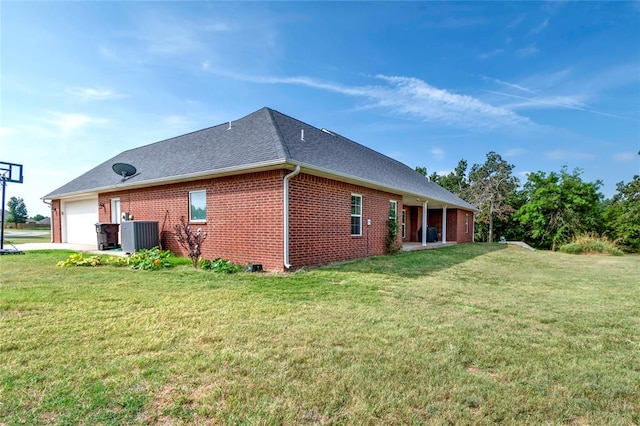 view of property exterior with a lawn, central AC unit, and a garage