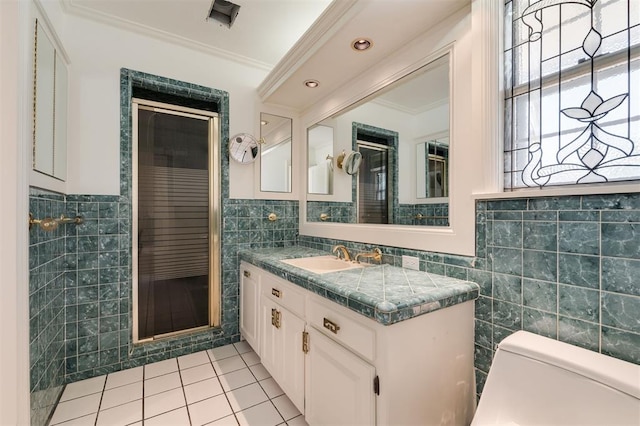 bathroom with toilet, tile walls, and ornamental molding