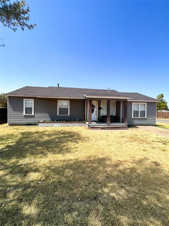 rear view of house with a lawn