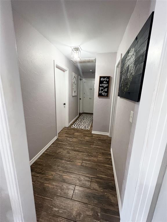 hall with dark hardwood / wood-style flooring