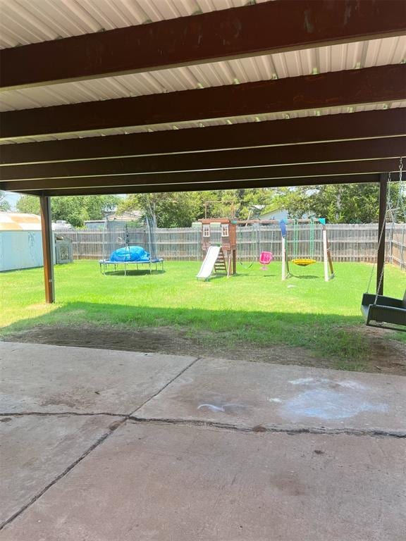 exterior space featuring a playground and a trampoline